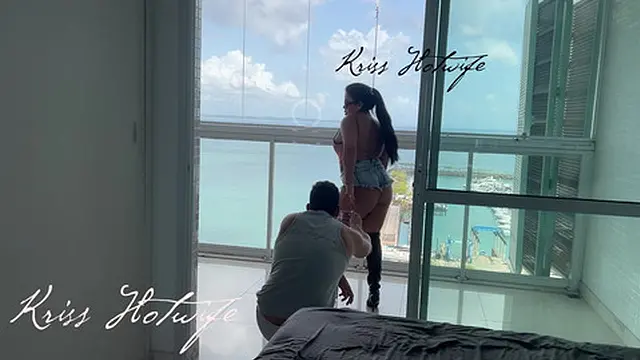 My husband′s cuckold filming me showing off on the balcony to the males in the pool