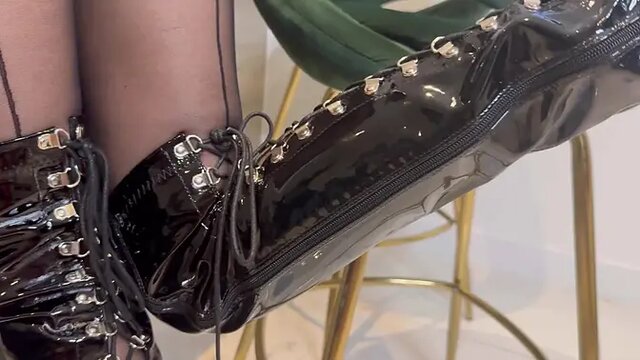 Seamy MILF teases with black pantyhose and leather boots