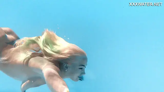 Hot milf pornstar Lisi swimming naked in the pool